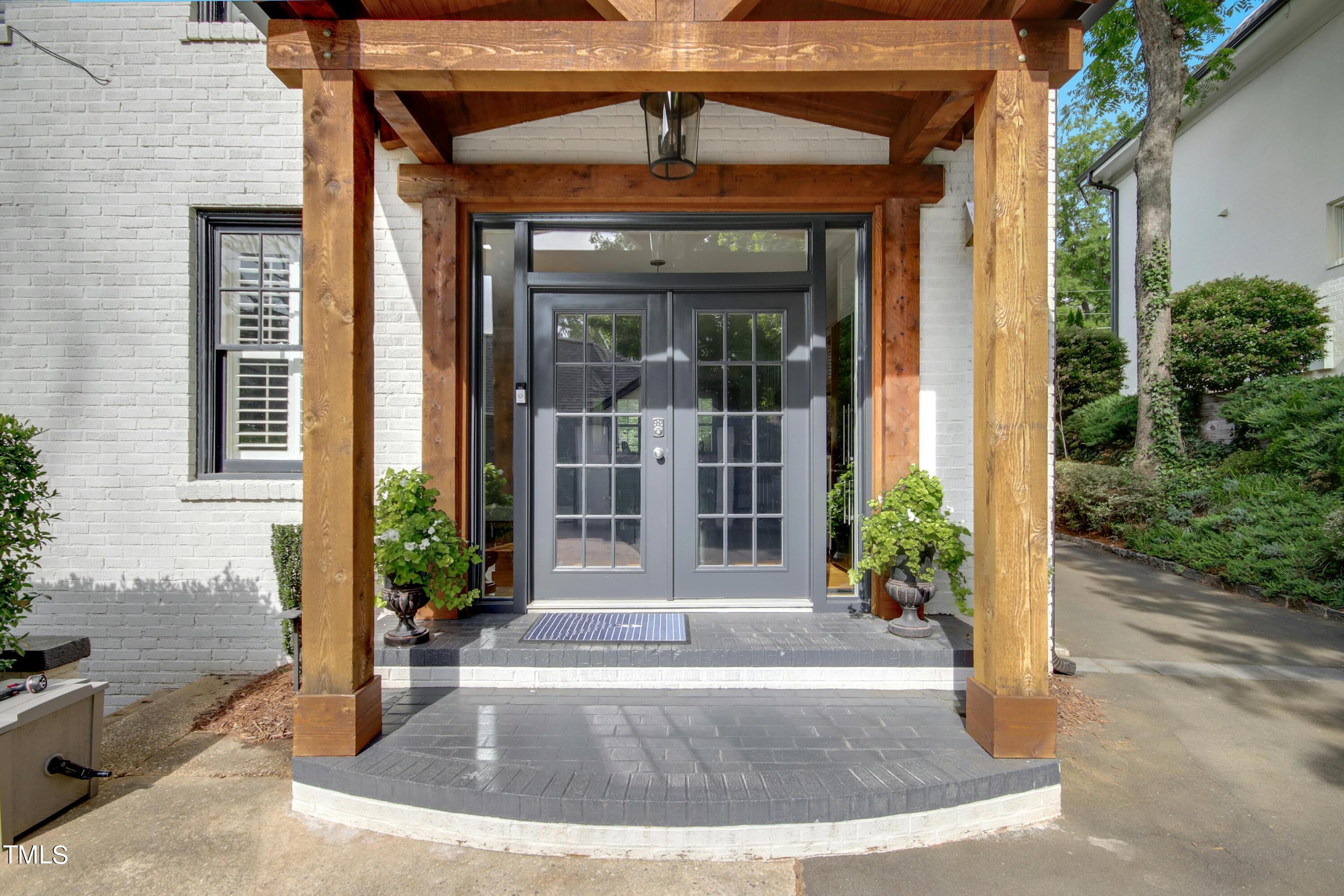 1512 Carr Street Raleigh, NC 27608 - Photo 42 of 60 a view of a brick house with potted plants