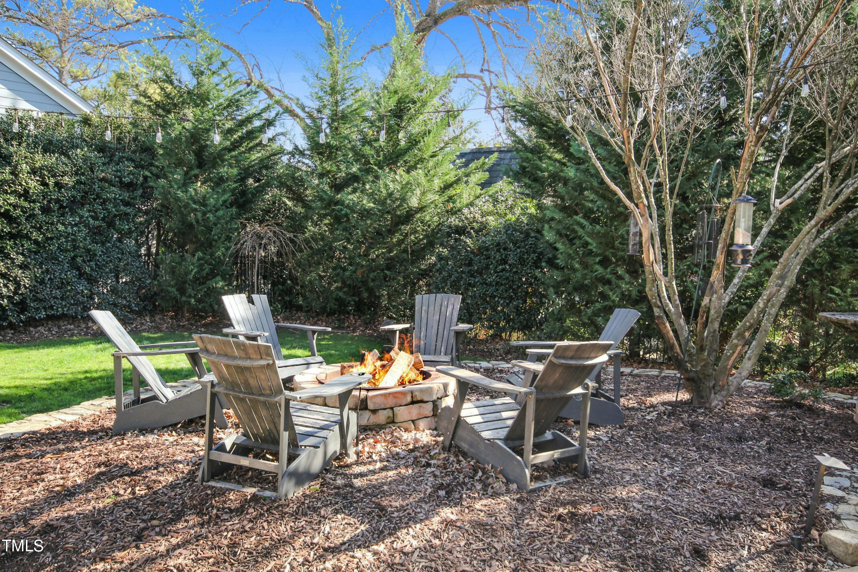 1512 Carr Street Raleigh, NC 27608 - Photo 46 of 60 a view of a chairs and table in a backyard