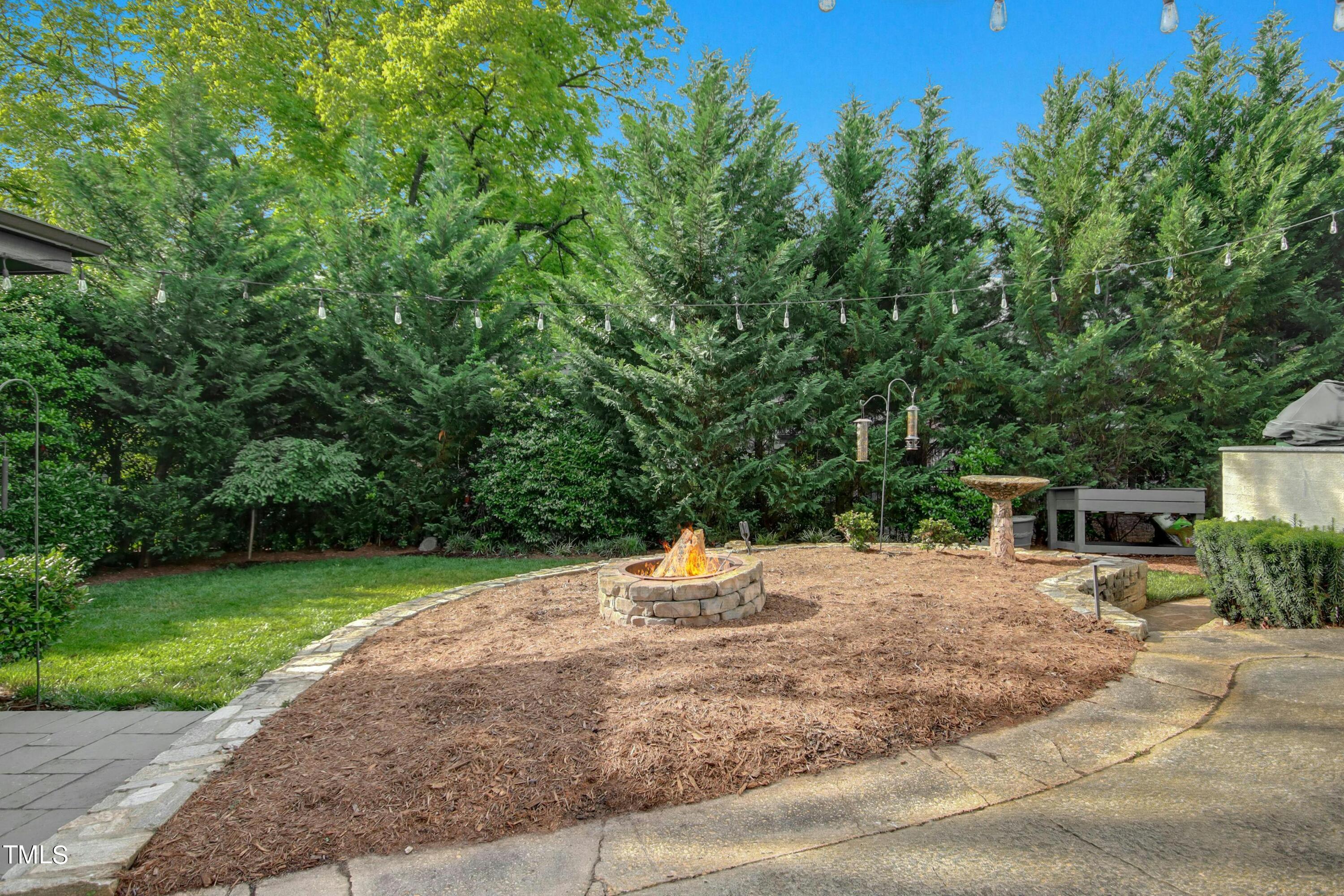 1512 Carr Street Raleigh, NC 27608 - Photo 49 of 60 a backyard of a house with yard and outdoor seating