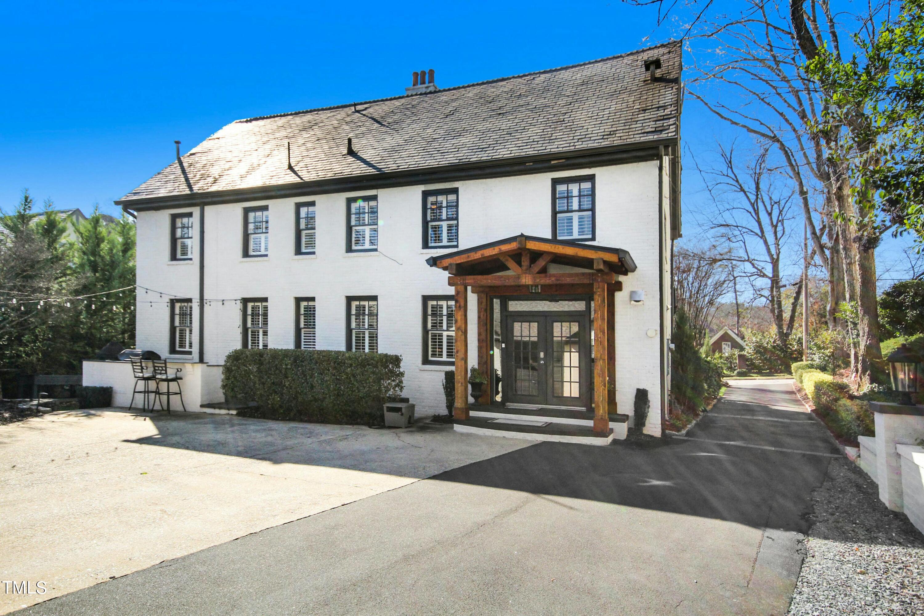 1512 Carr Street Raleigh, NC 27608 - Photo 51 of 60 a view of a white house with a large tree