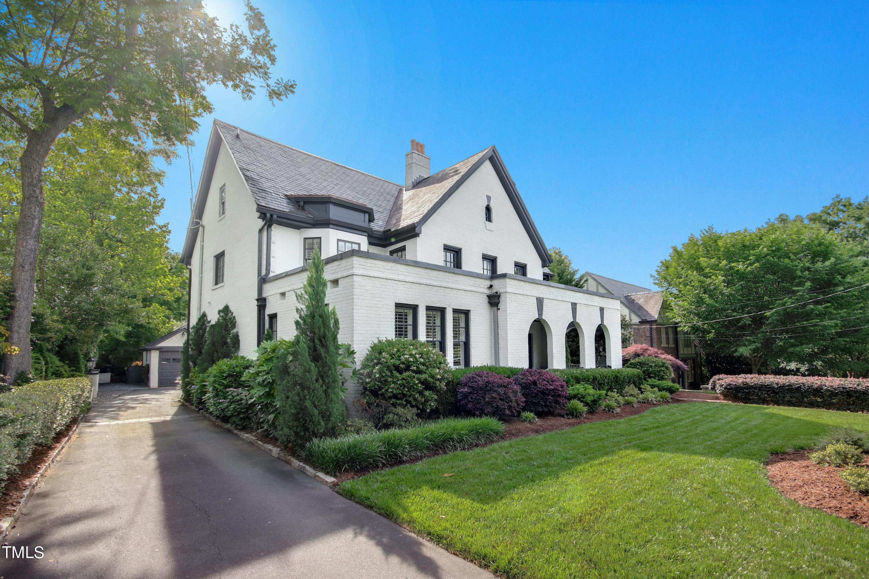 1512 Carr Street Raleigh, NC 27608 - Photo 55 of 60 a front view of a house with a yard
