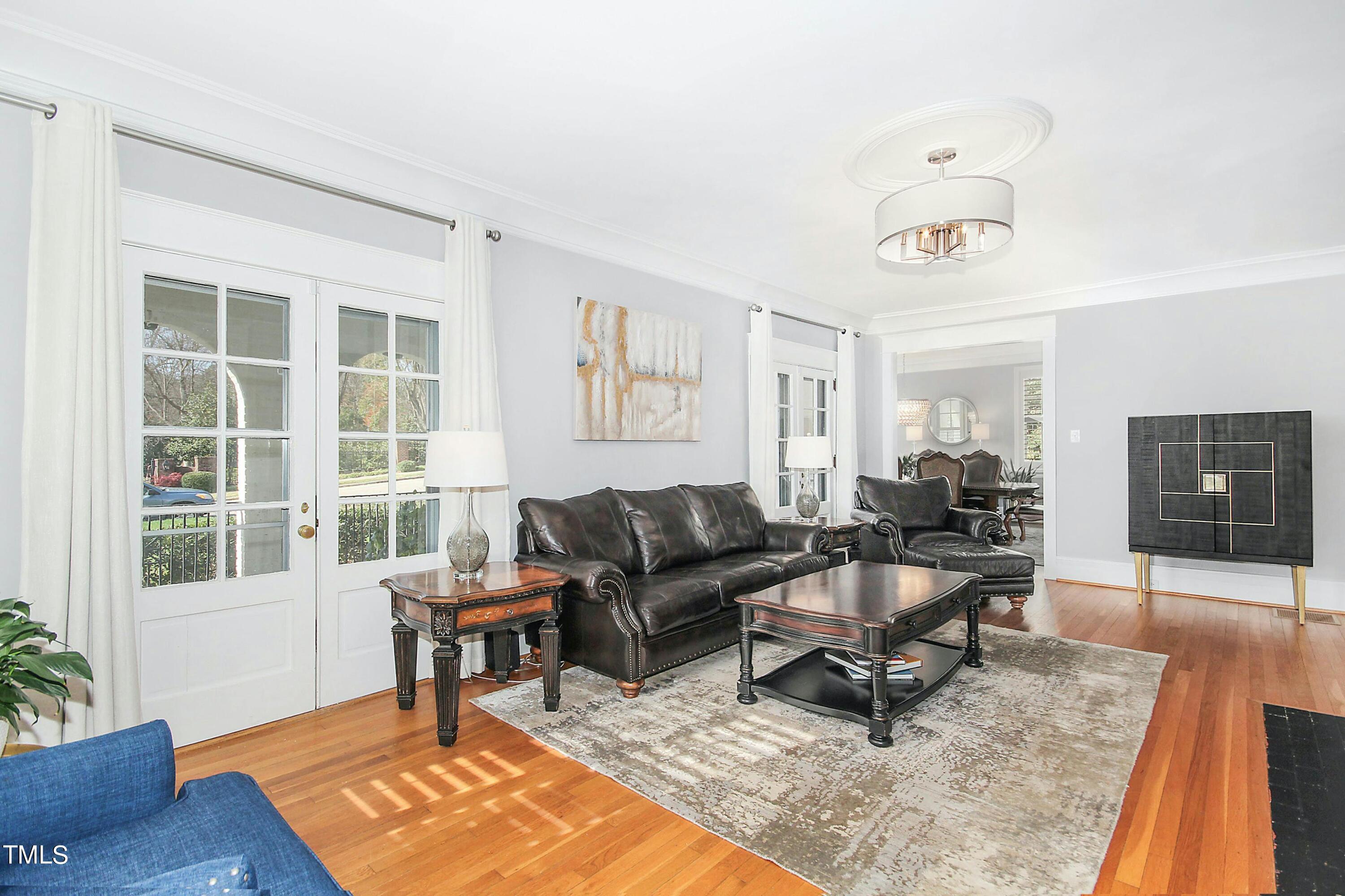 1512 Carr Street Raleigh, NC 27608 - Photo 6 of 60 a living room with furniture a rug and a window