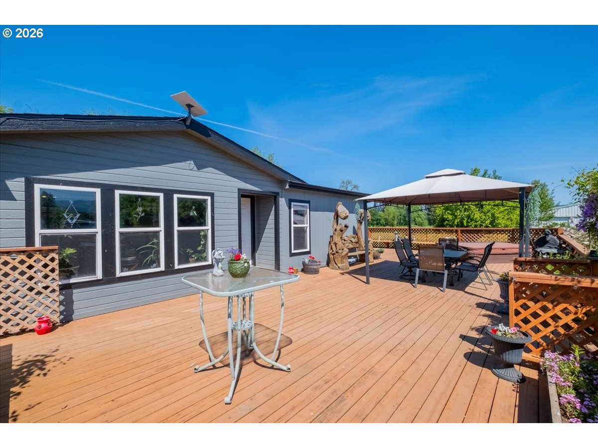 35377 Ede Road Lebanon, OR 97355 - Photo 27 of 48 a view of a house with backyard porch and sitting area