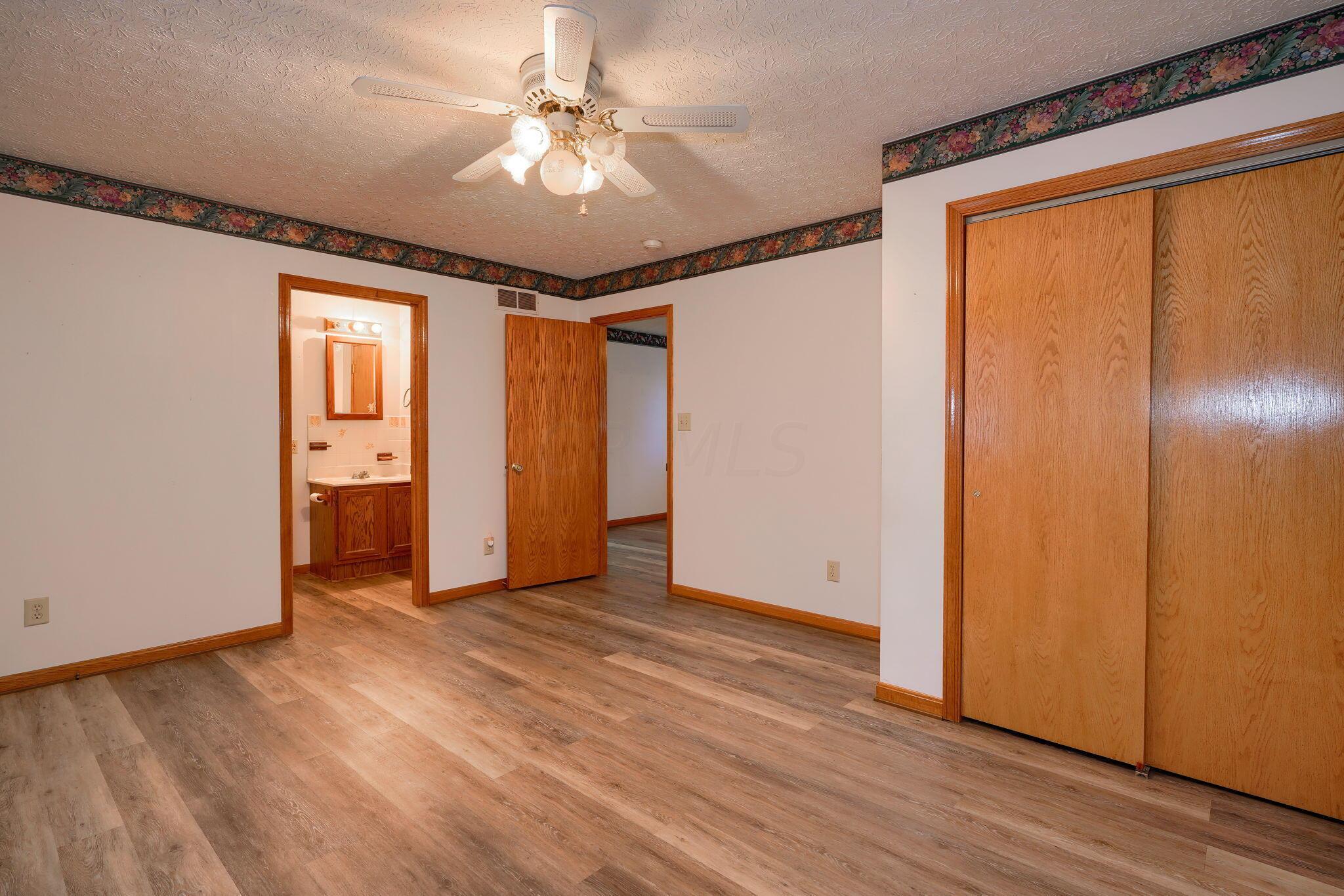 191 Rockwell Road Columbus, OH 43207 - Photo 13 of 28 Bedroom has double closet, ceiling fan and beautiful flooring,