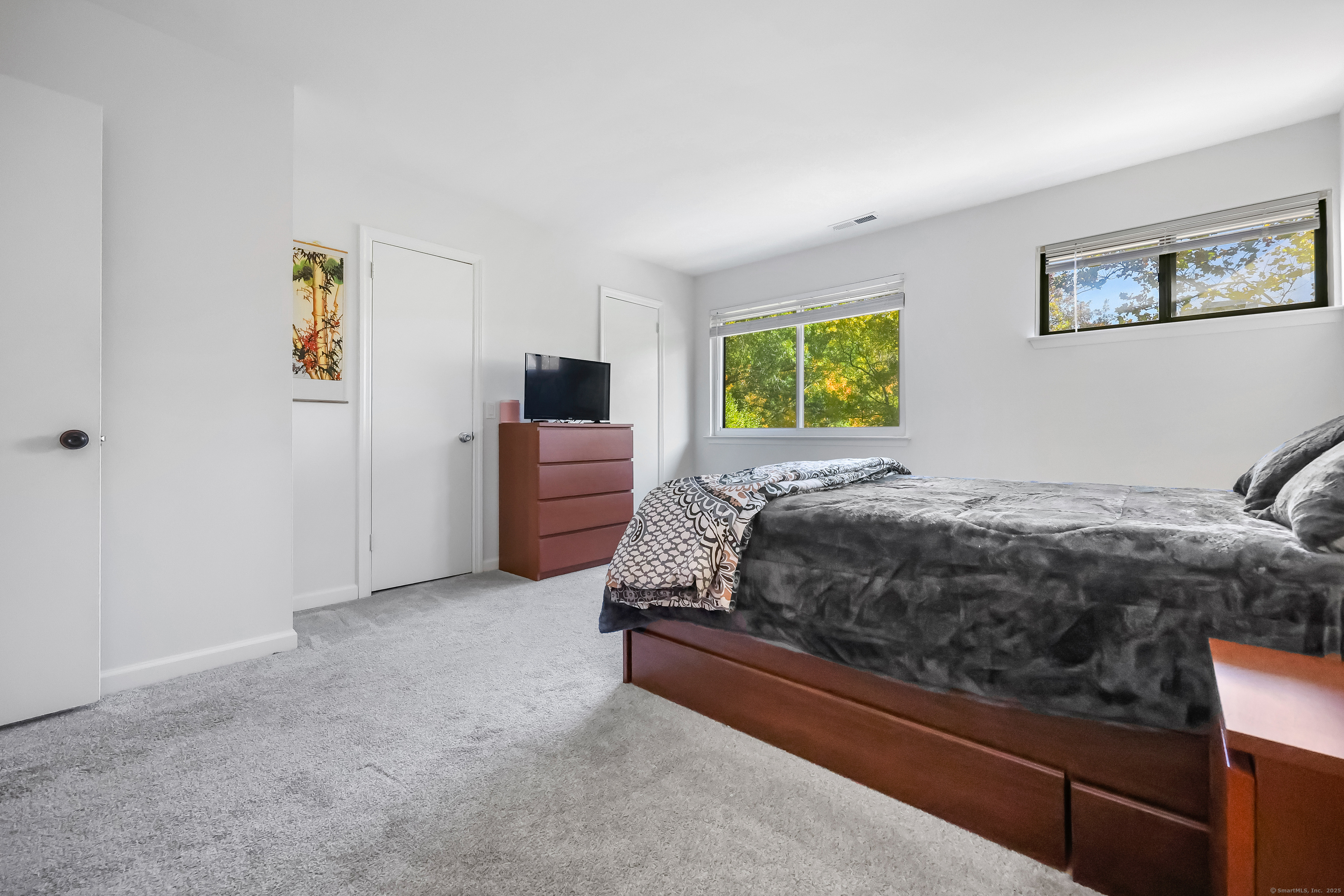 34 Sunrise Hill Road, Unit 34 Norwalk, CT 06851 - Photo 14 of 29 a bedroom with a bed and a couch