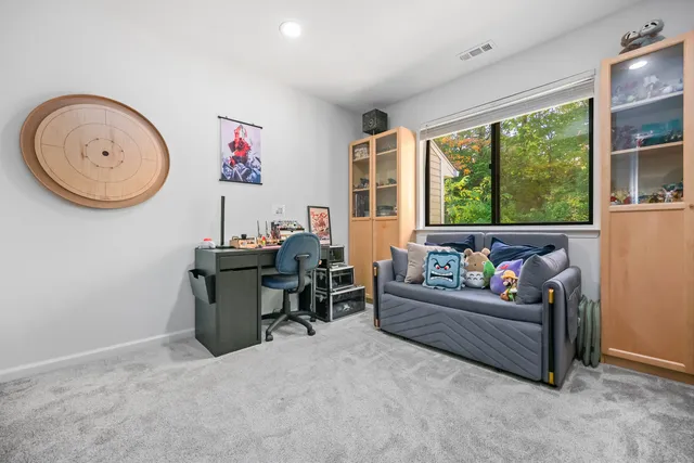 a living room with furniture a window and a fireplace