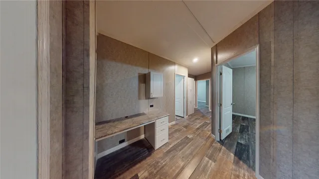 a spacious bathroom with a double vanity sink and a mirror