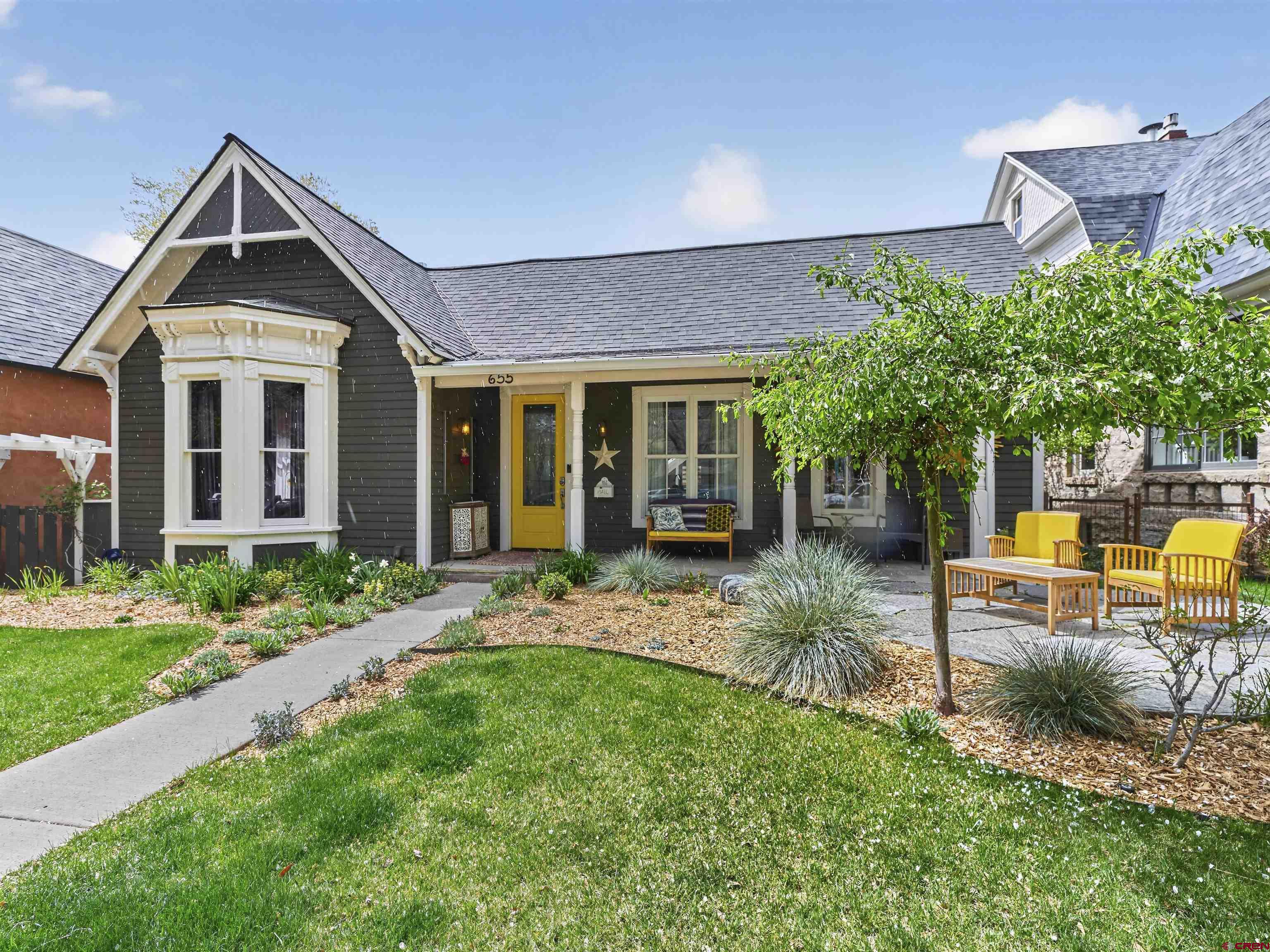 a front view of a house with garden
