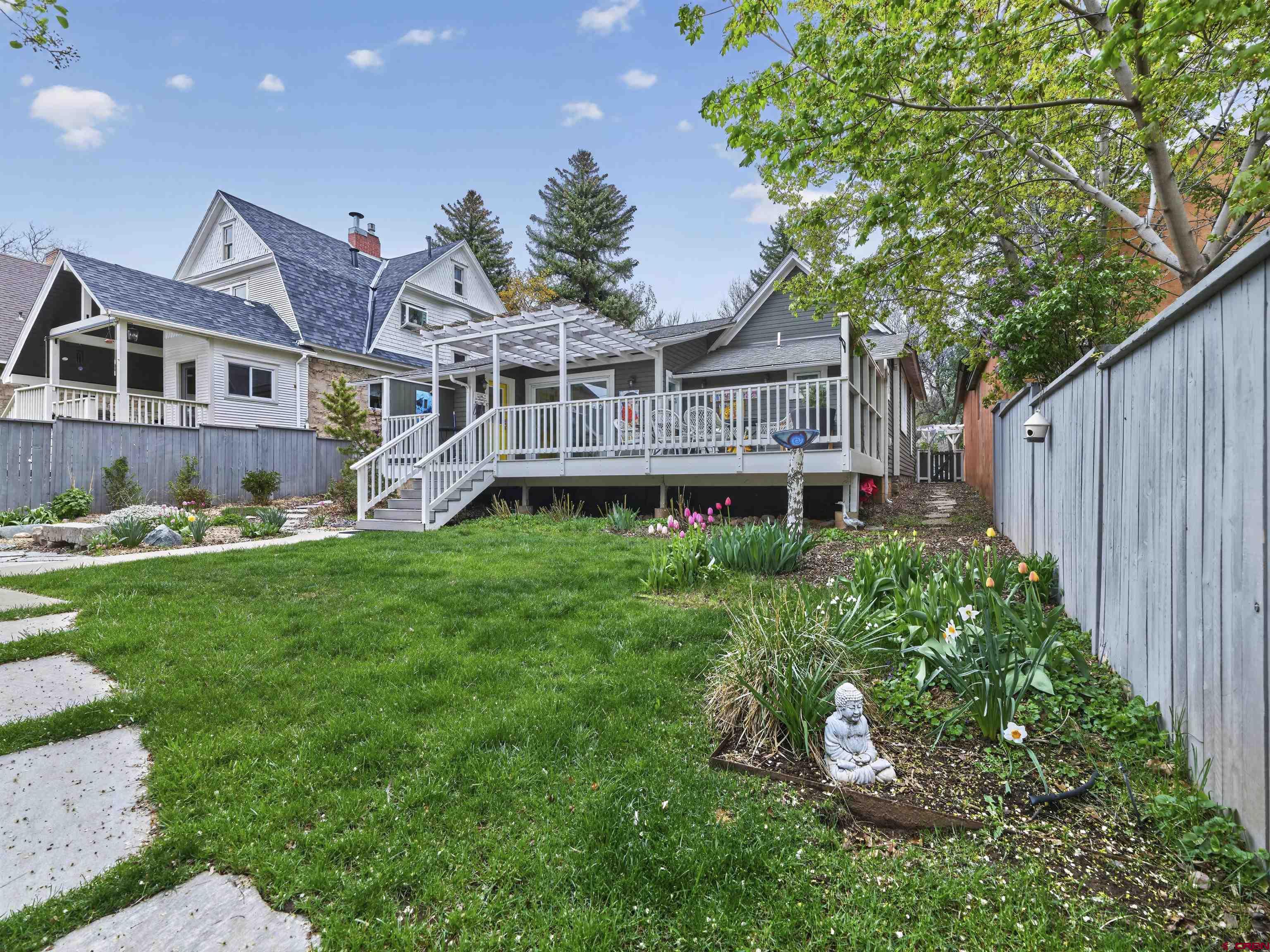 655 East 3rd Avenue Durango, CO 81301 - Photo 21 of 38 a front view of a house with garden