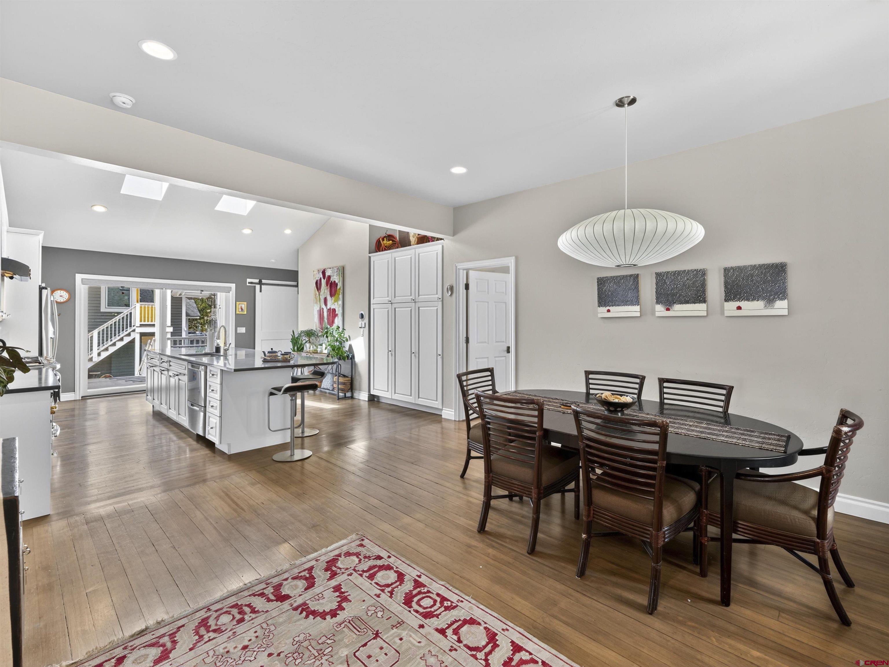 655 East 3rd Avenue Durango, CO 81301 - Photo 3 of 38 a view of a dining room with furniture and wooden floor