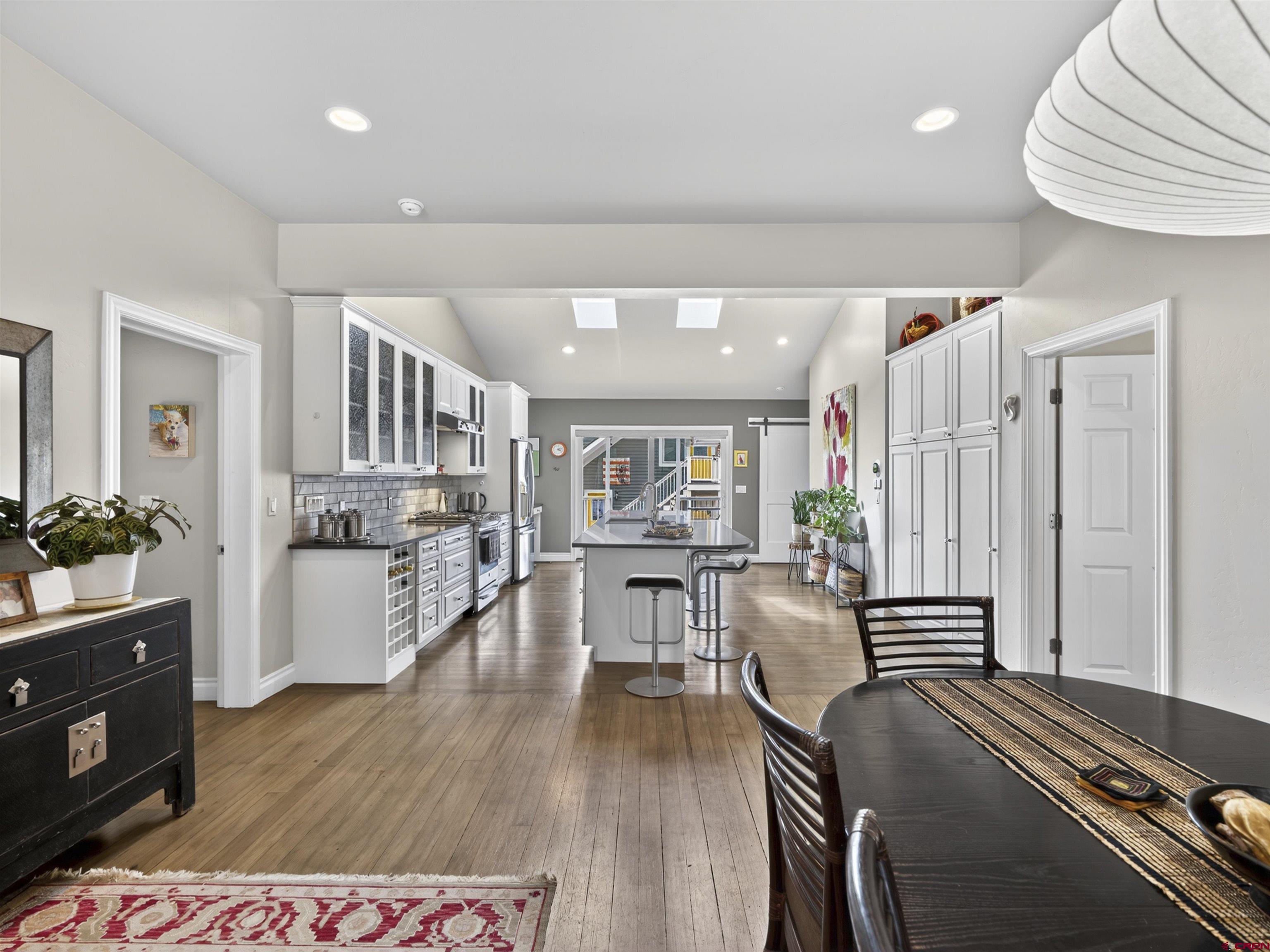 655 East 3rd Avenue Durango, CO 81301 - Photo 4 of 38 a living room with furniture and a wooden floor