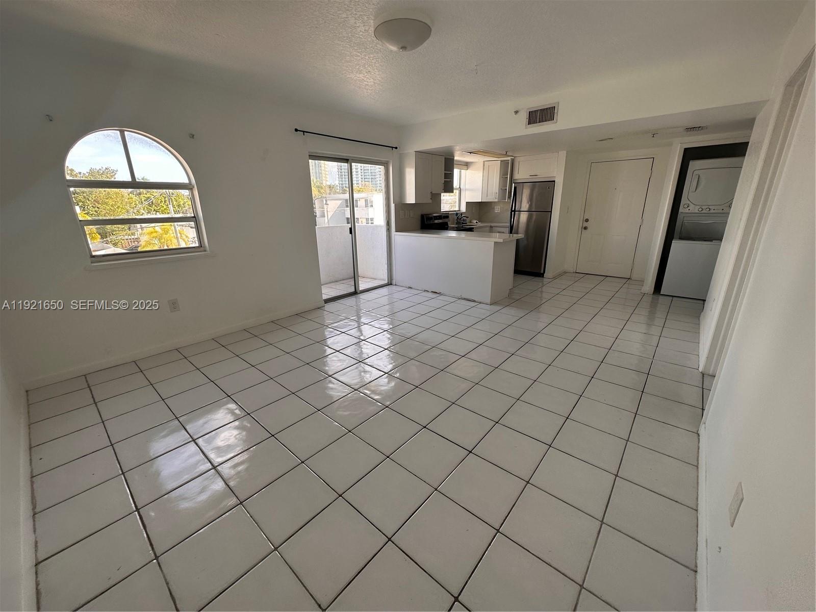 3052 Southwest 27th Avenue, Unit 301 Miami, FL 33133 - Photo 13 of 21 a view of empty room with wooden floor
