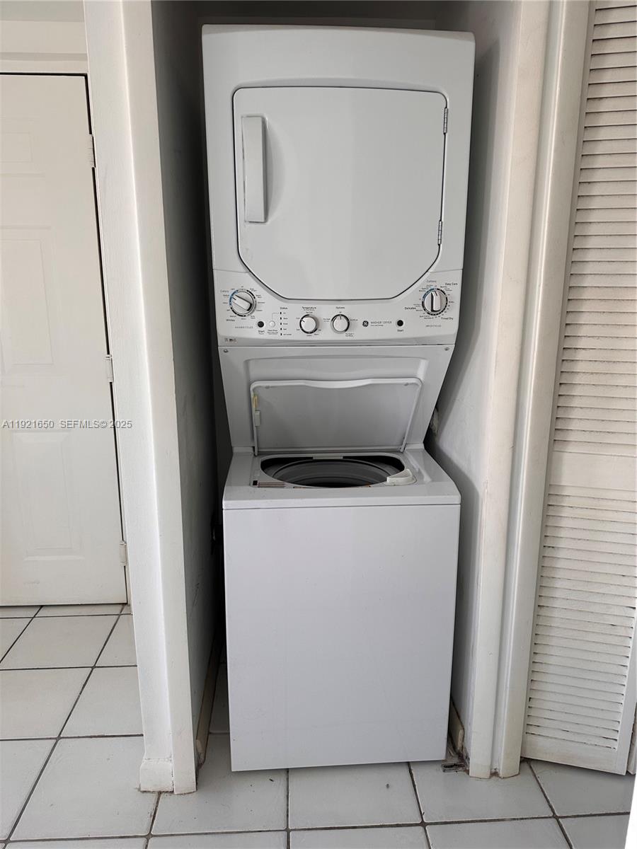 3052 Southwest 27th Avenue, Unit 301 Miami, FL 33133 - Photo 17 of 21 a utility room with dryer and washer