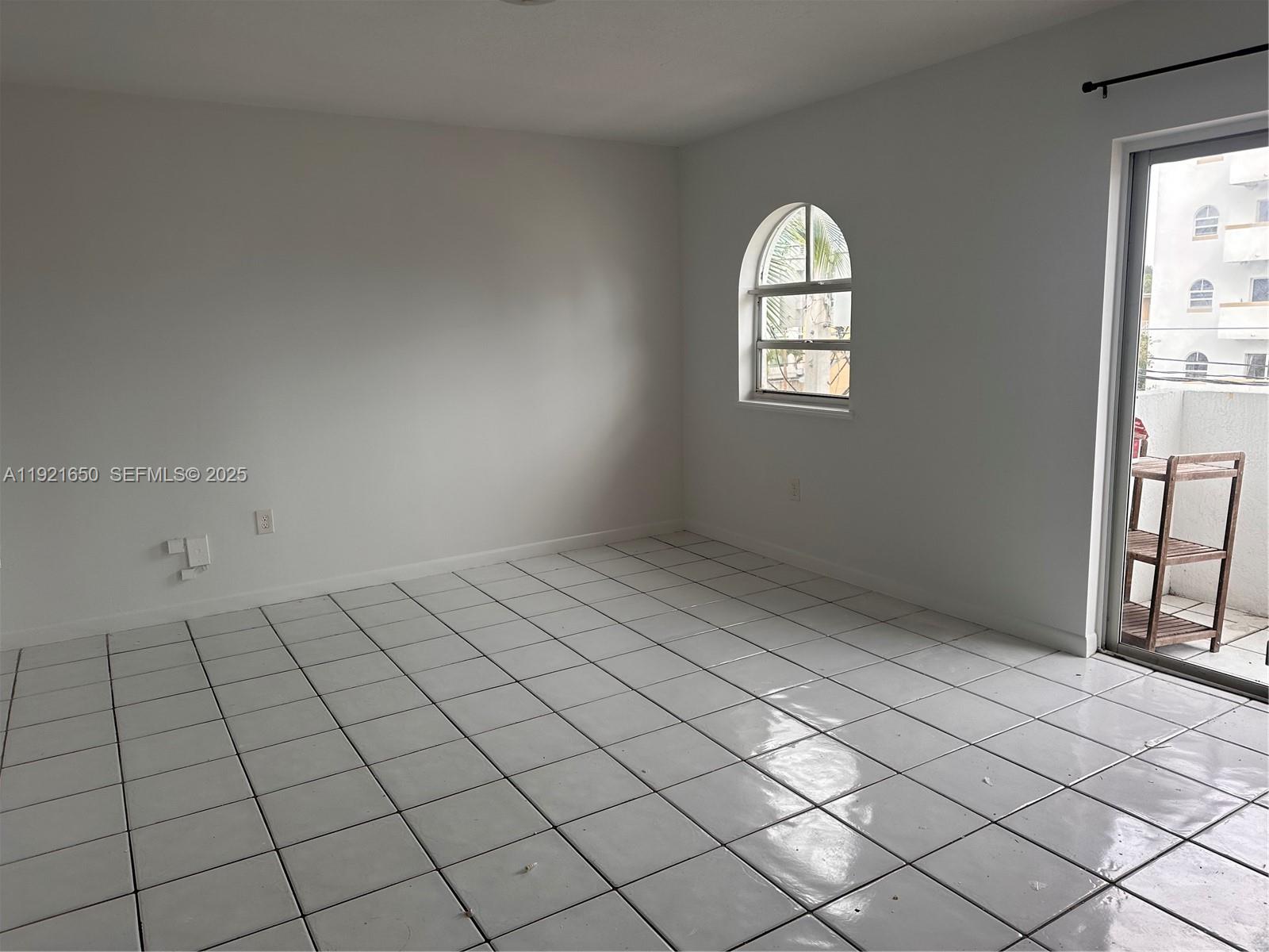 3052 Southwest 27th Avenue, Unit 301 Miami, FL 33133 - Photo 10 of 21 an empty room with windows