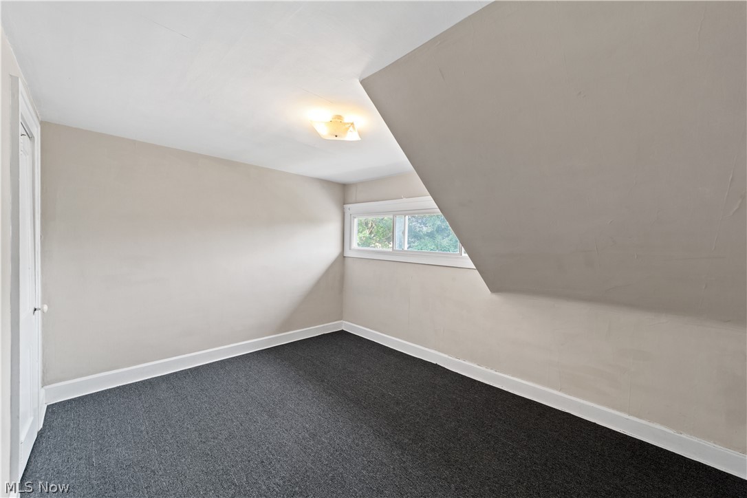 3076 Yorkshire Road Cleveland, OH 44118 - Photo 23 of 47 Bonus room with carpet floors and vaulted ceiling