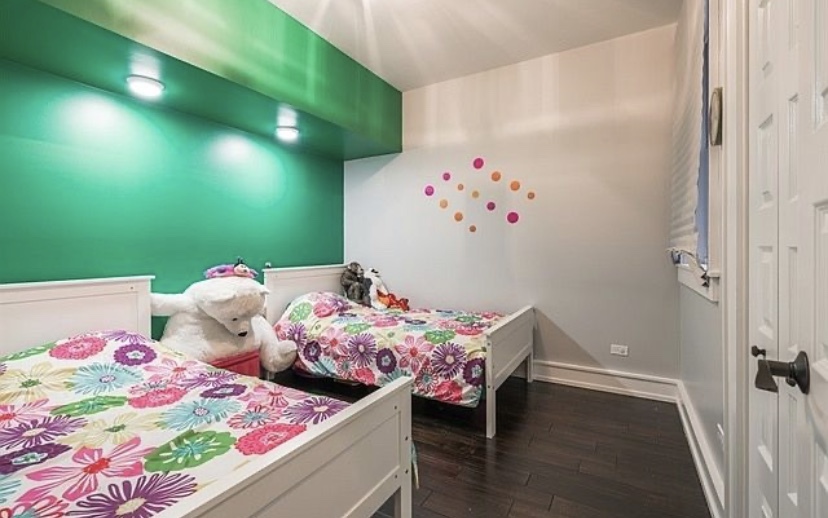 37 North Morgan Street, Unit 2 Chicago, IL 60607 - Photo 11 of 14 a bedroom with baby bed and a dresser