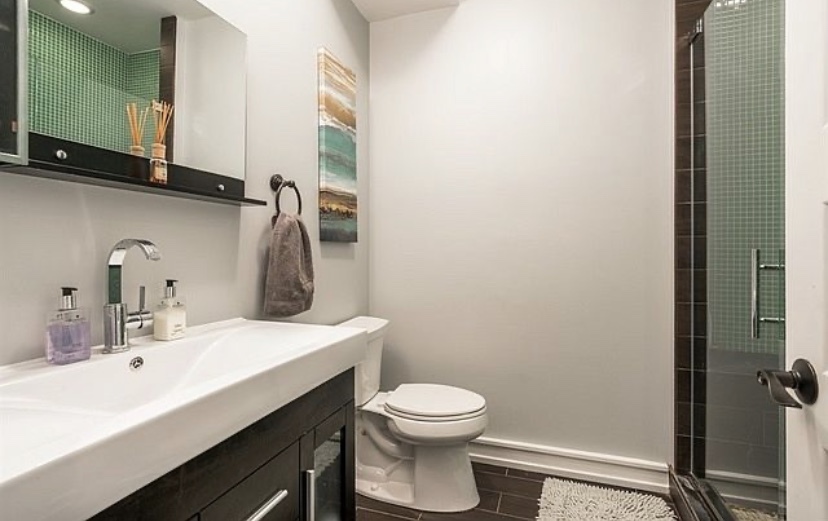 37 North Morgan Street, Unit 2 Chicago, IL 60607 - Photo 12 of 14 a bathroom with a sink toilet and mirror