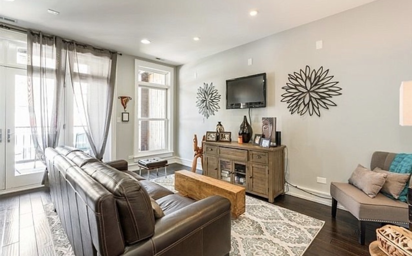 37 North Morgan Street, Unit 2 Chicago, IL 60607 - Photo 2 of 14 a living room with furniture and a flat screen tv