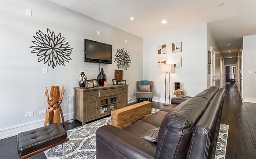 37 North Morgan Street, Unit 2 Chicago, IL 60607 - Photo 4 of 14 a living room with furniture and a flat screen tv