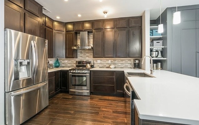 37 North Morgan Street, Unit 2 Chicago, IL 60607 - Photo 5 of 14 a kitchen with stainless steel appliances a refrigerator and a stove top oven