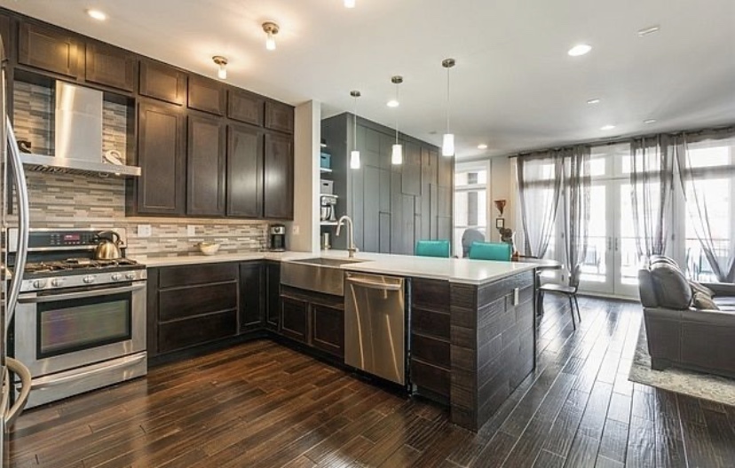37 North Morgan Street, Unit 2 Chicago, IL 60607 - Photo 6 of 14 a large kitchen with stainless steel appliances granite countertop a stove and a wooden floors