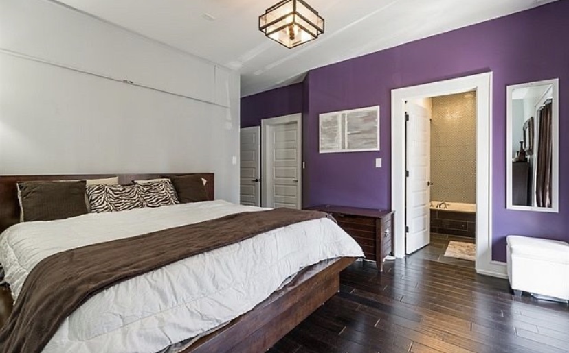 37 North Morgan Street, Unit 2 Chicago, IL 60607 - Photo 9 of 14 a bedroom with a bed and dresser with wooden floor