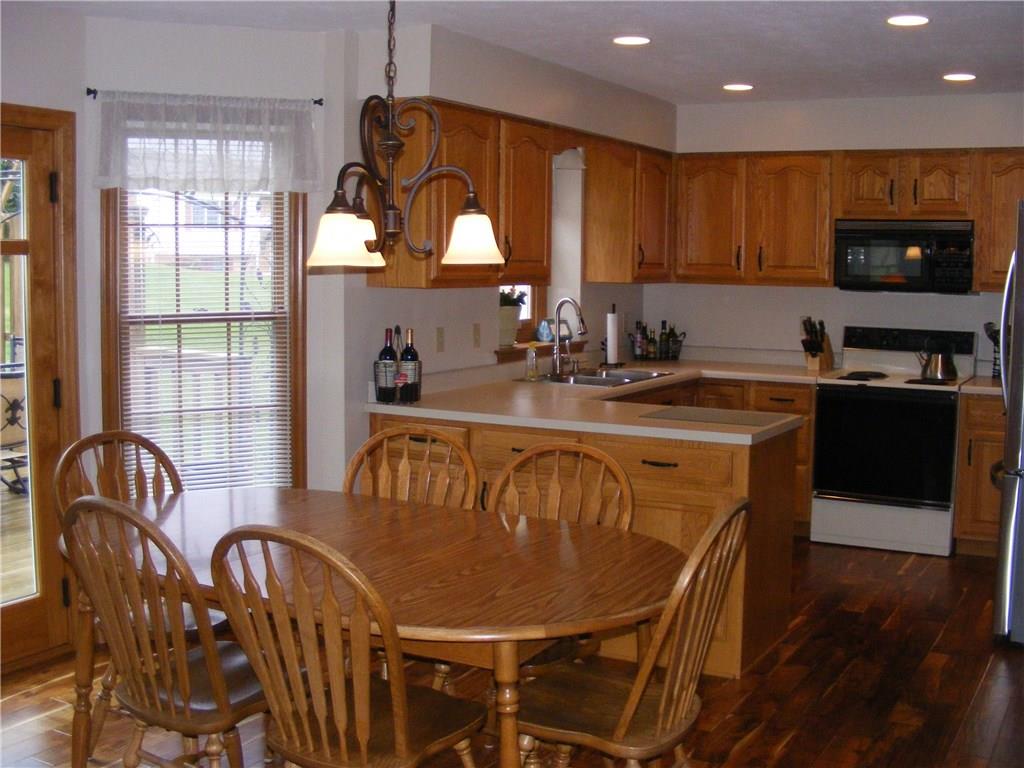 304 Kozy Corner Road Valencia, PA 16059 - Photo 5 of 23 Eat-In-Kitchen Area Leading Into Kitchen With Bump-Out Window Leading to Deck on Back of Home