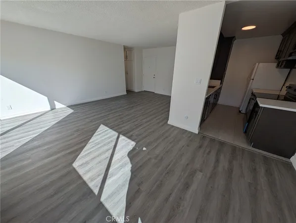 a view of wooden floor in an empty room