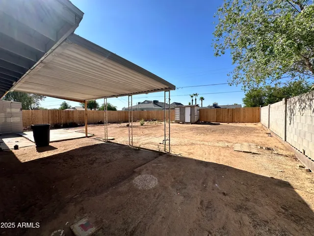 a view of pool with a yard