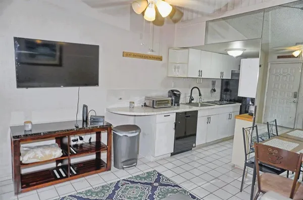 a kitchen with a sink cabinets and window