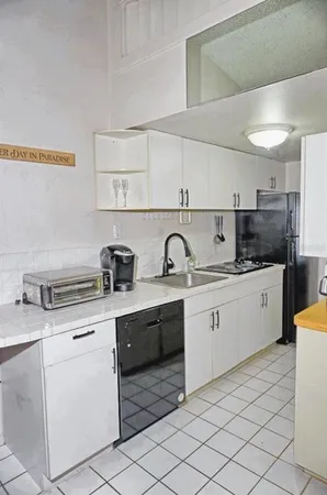 a kitchen with a sink and cabinets