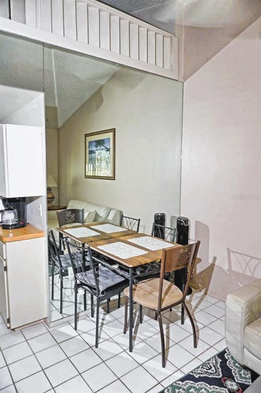 20893 Haulover Cove Road, Unit 8 Lutz, FL 33558 - Photo 17 of 35 a view of a dining room with furniture