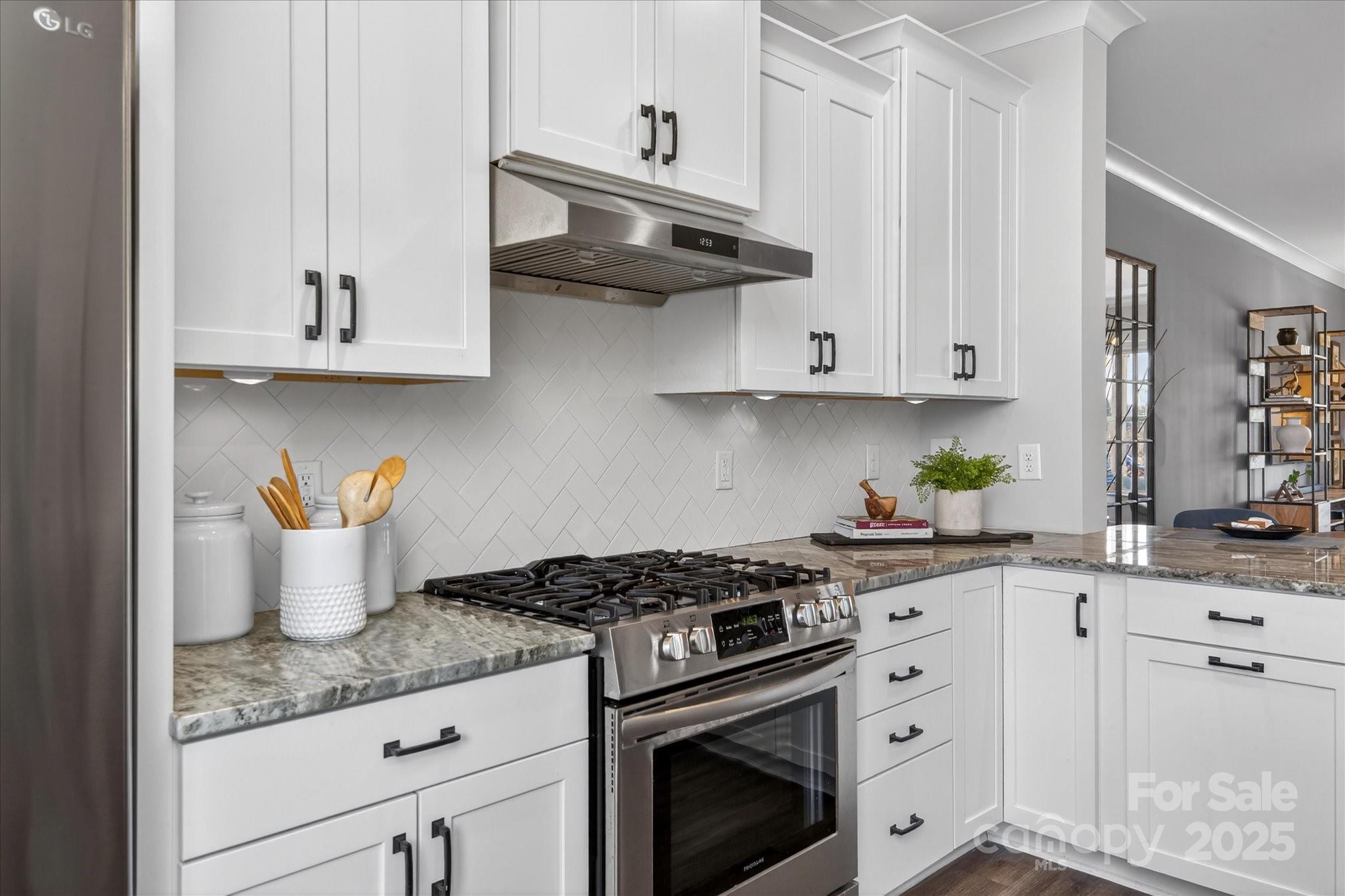 676 Dunkins Ferry Road Rock Hill, SC 29730 - Photo 17 of 47 a kitchen with stainless steel appliances granite countertop a sink stove and cabinets