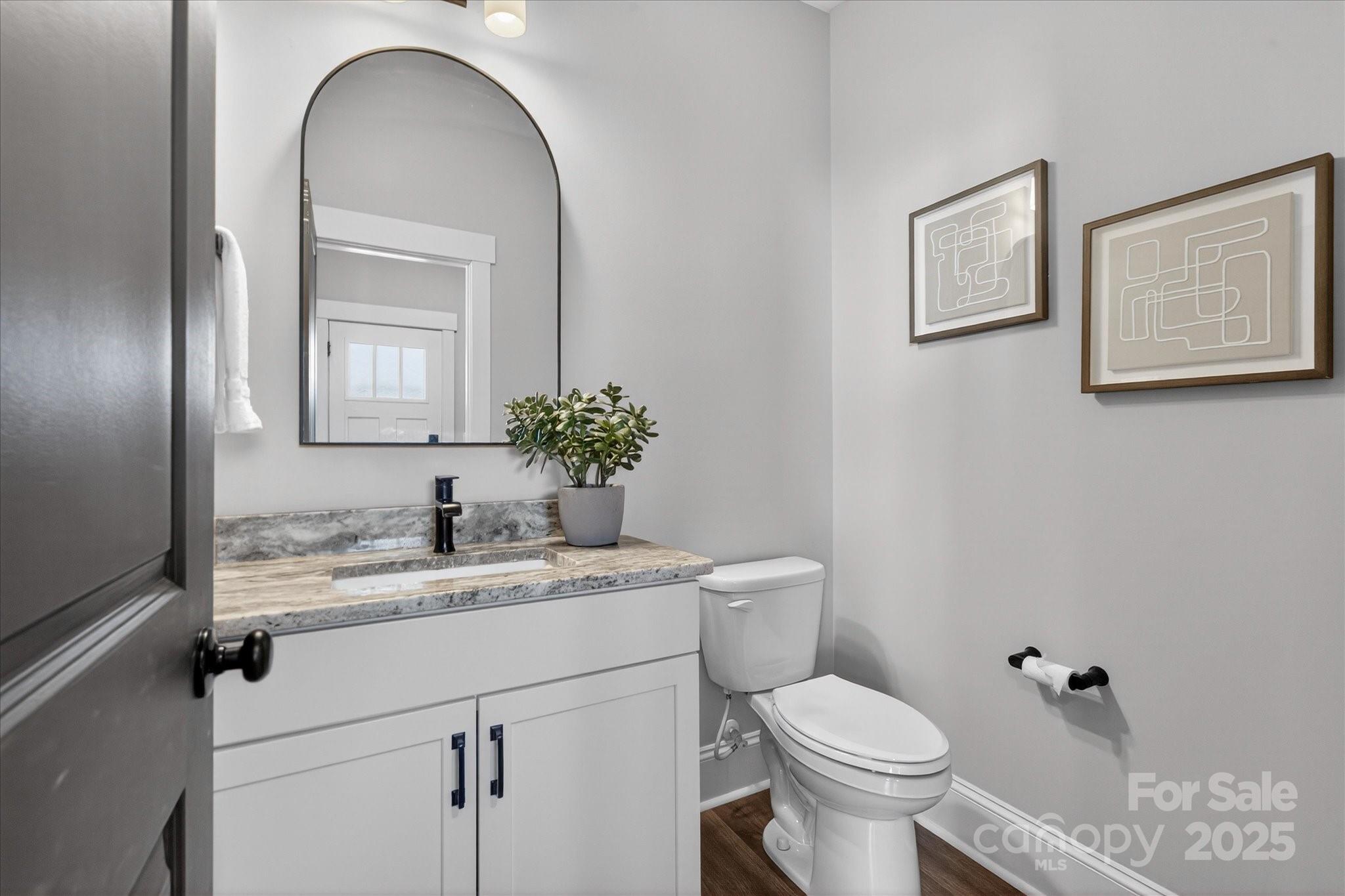 676 Dunkins Ferry Road Rock Hill, SC 29730 - Photo 21 of 47 a bathroom with a toilet sink and mirror