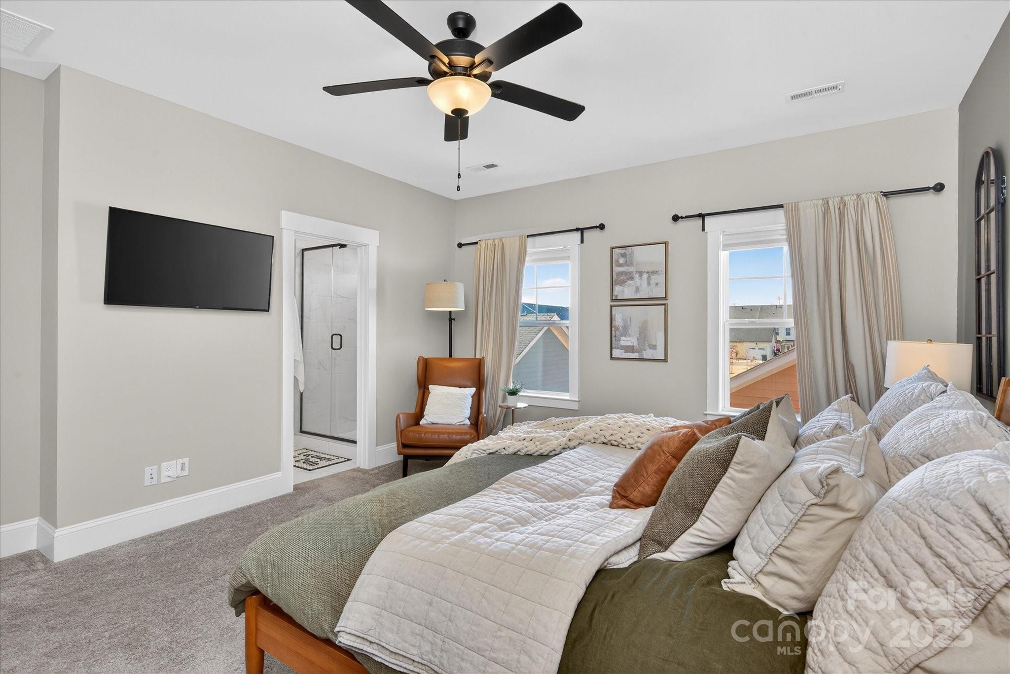 676 Dunkins Ferry Road Rock Hill, SC 29730 - Photo 23 of 47 a bedroom with a bed and a flat screen tv