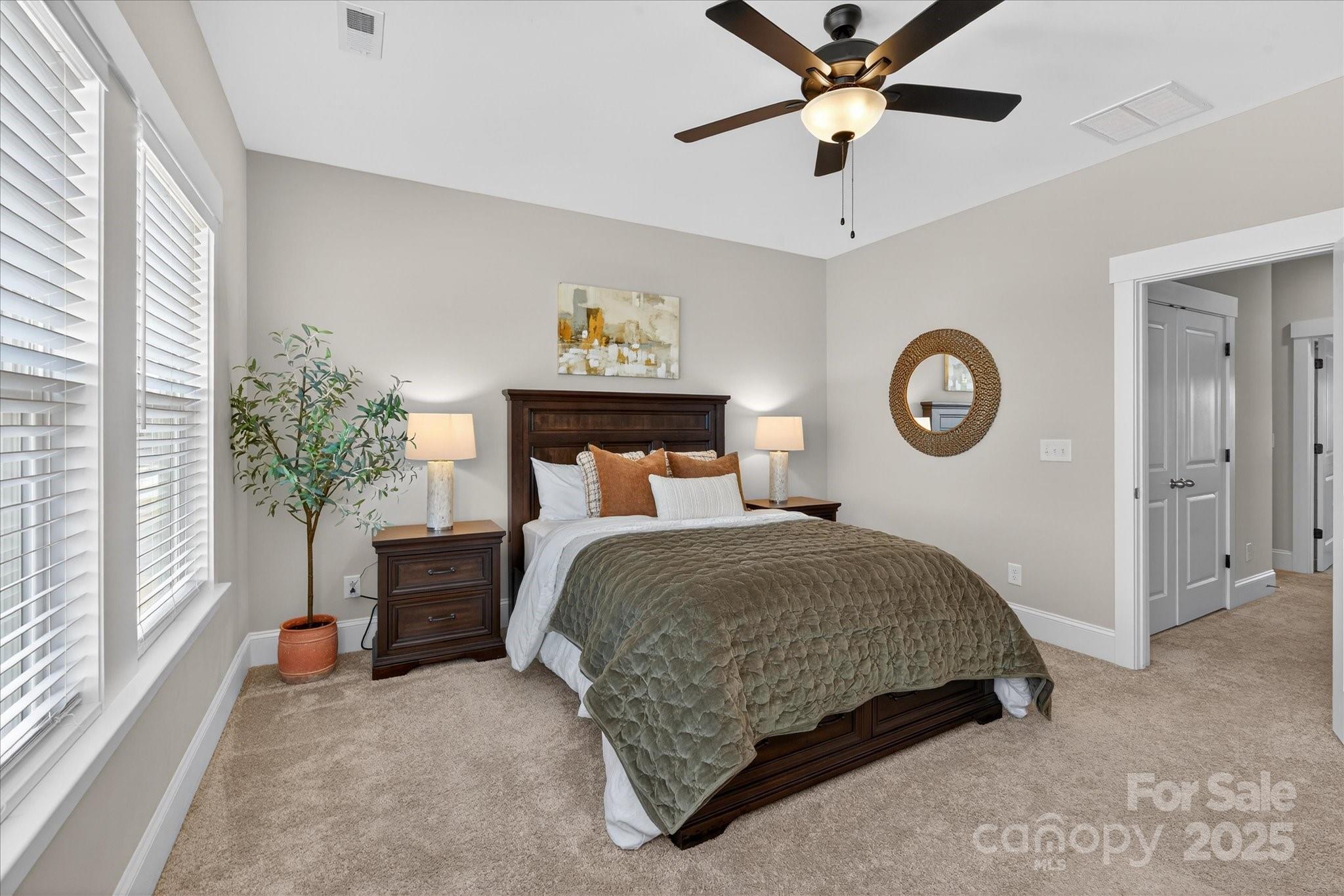 676 Dunkins Ferry Road Rock Hill, SC 29730 - Photo 27 of 47 a bedroom with a bed and a chandelier