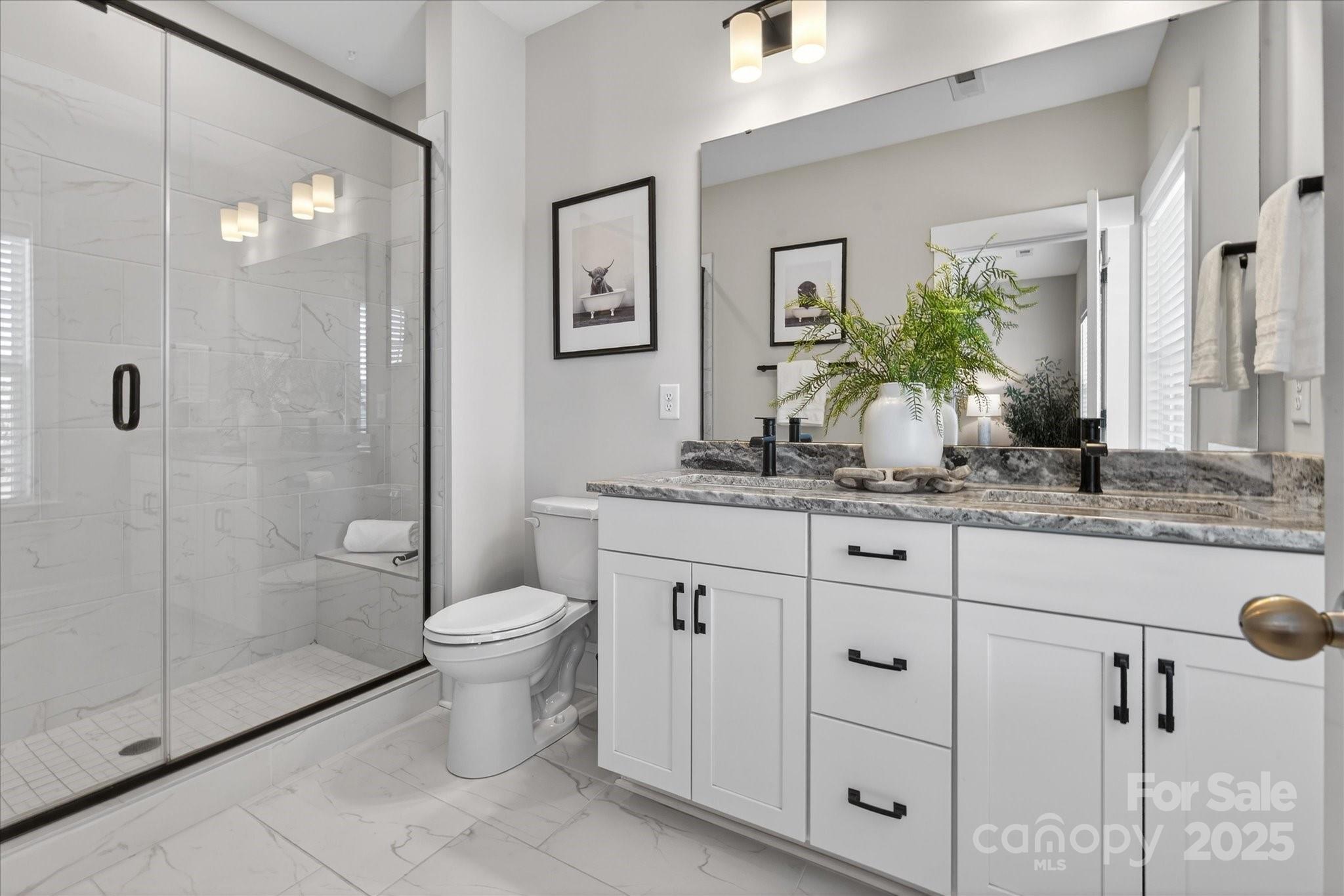 676 Dunkins Ferry Road Rock Hill, SC 29730 - Photo 28 of 47 a bathroom with a granite countertop sink toilet and shower