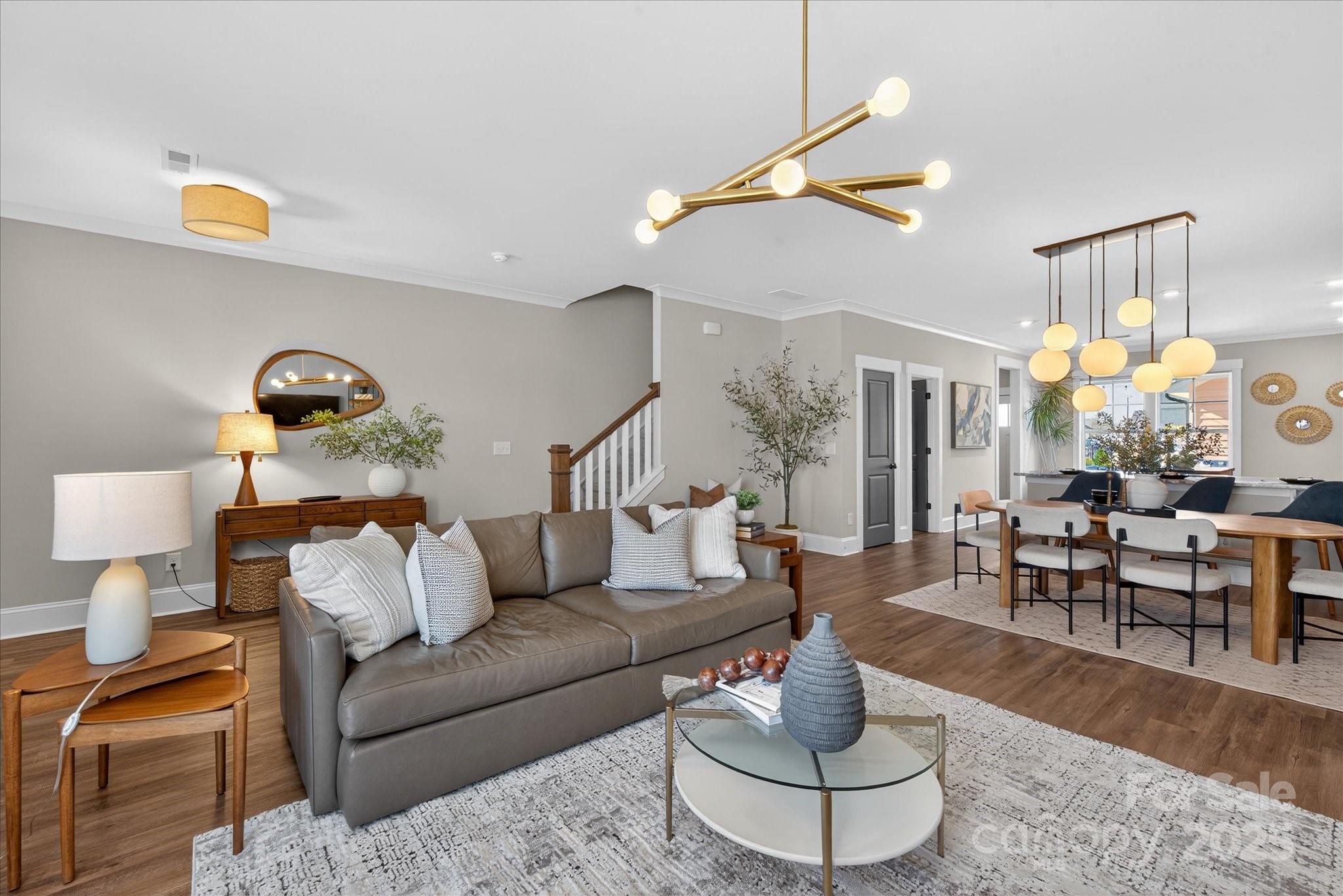 676 Dunkins Ferry Road Rock Hill, SC 29730 - Photo 10 of 47 a living room with furniture and a chandelier