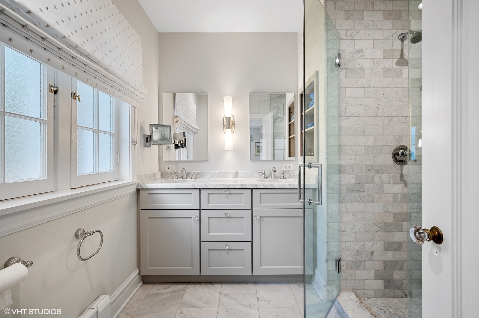 1002 Monroe Avenue River Forest, IL 60305 - Photo 16 of 31 a bathroom with a double vanity sink a mirror and a shower