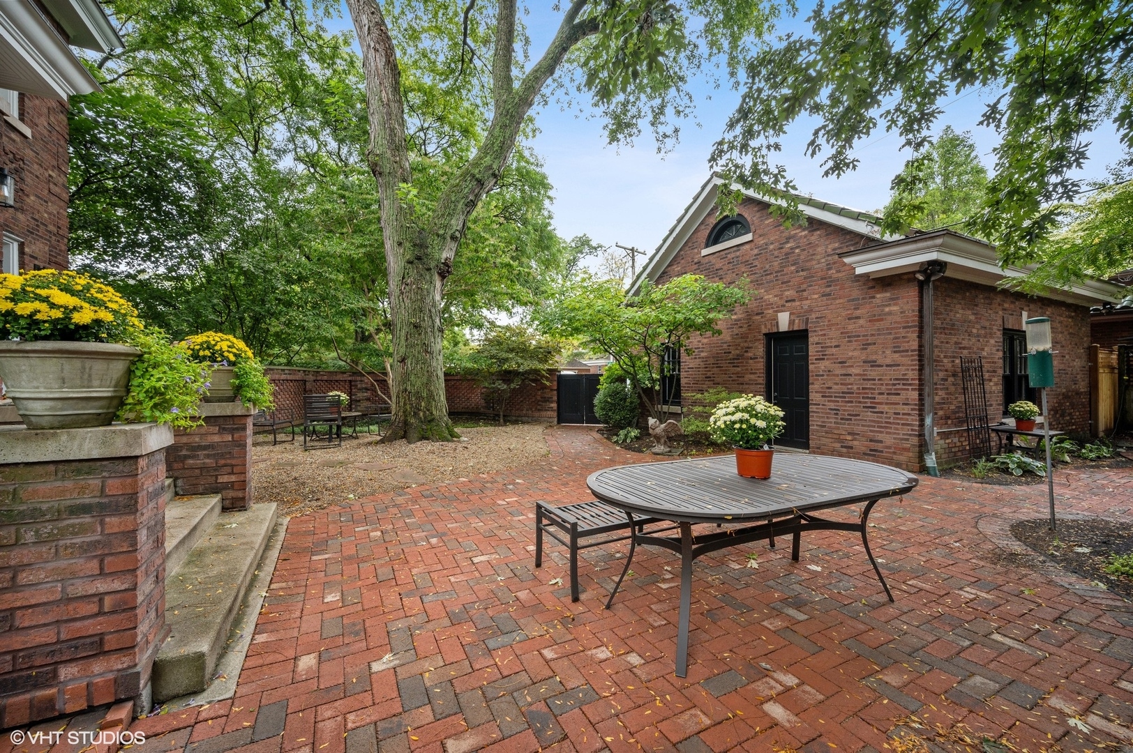 1002 Monroe Avenue River Forest, IL 60305 - Photo 24 of 31 a backyard of a house with a table and chairs