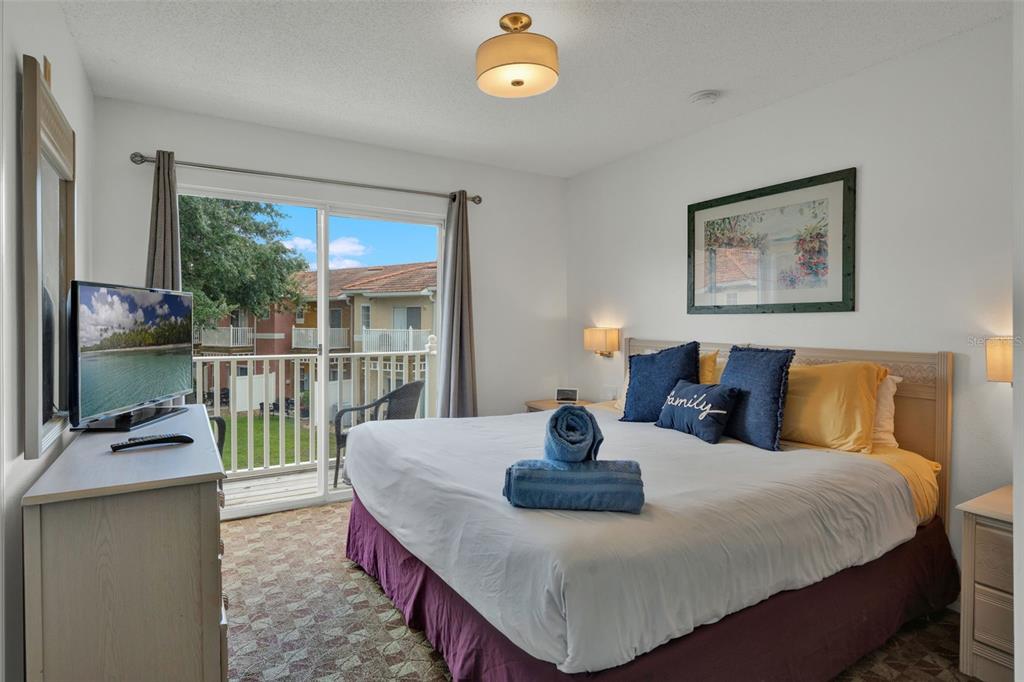 1086 Park Ridge Circle Kissimmee, FL 34746 - Photo 13 of 57 a bedroom with furniture and a window