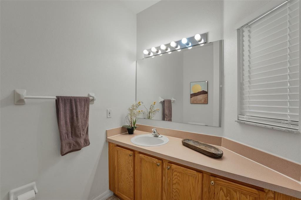 1086 Park Ridge Circle Kissimmee, FL 34746 - Photo 16 of 57 a bathroom with a sink a double vanity and a mirror