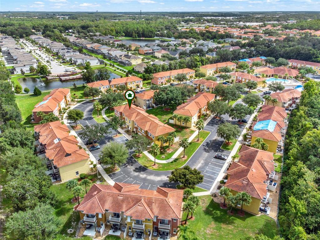 1086 Park Ridge Circle Kissimmee, FL 34746 - Photo 31 of 57 an aerial view of residential houses with outdoor space and trees