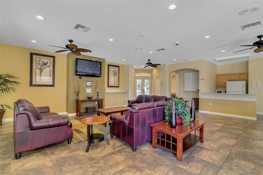 1086 Park Ridge Circle Kissimmee, FL 34746 - Photo 40 of 57 a living room with furniture and a flat screen tv
