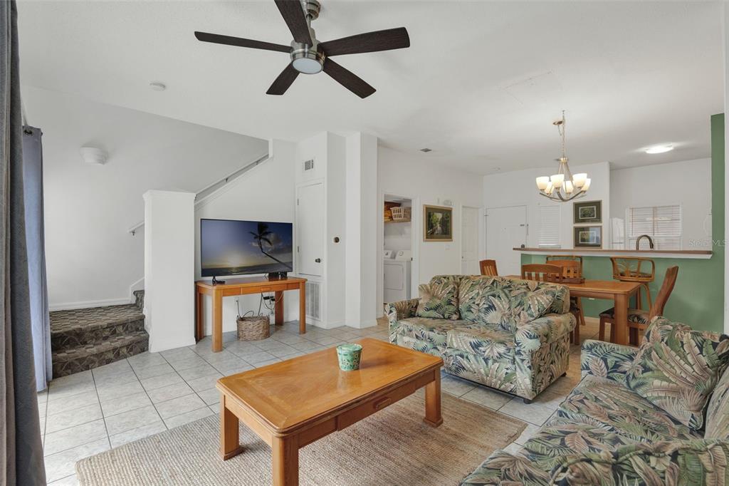 1086 Park Ridge Circle Kissimmee, FL 34746 - Photo 4 of 57 a living room with furniture and a flat screen tv