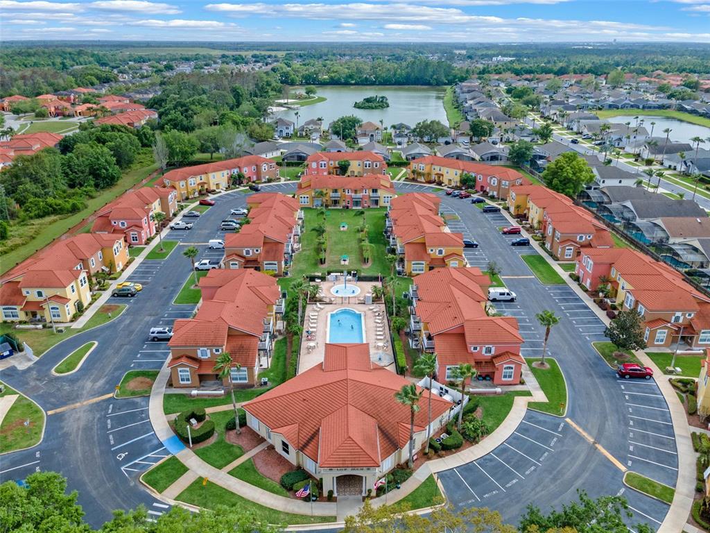 1086 Park Ridge Circle Kissimmee, FL 34746 - Photo 45 of 57 an aerial view of residential houses with outdoor space and parking