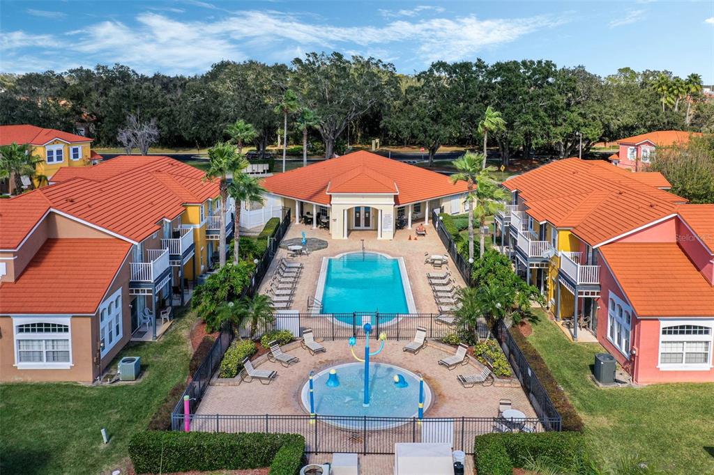 1086 Park Ridge Circle Kissimmee, FL 34746 - Photo 46 of 57 a view of a swimming pool with a patio and a garden