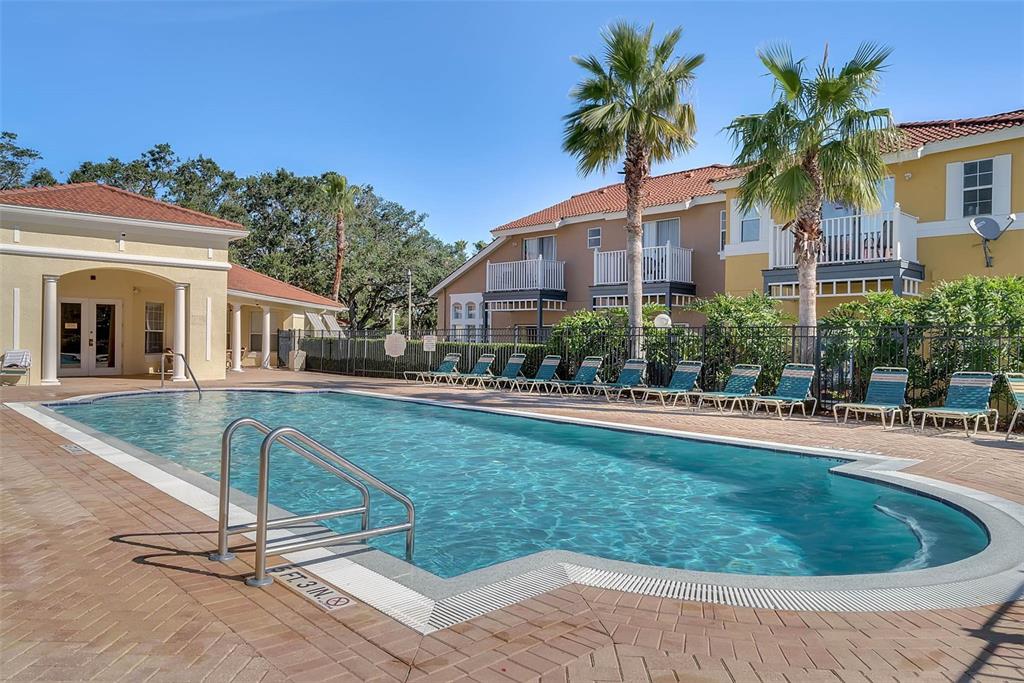 1086 Park Ridge Circle Kissimmee, FL 34746 - Photo 52 of 57 a view of a house with a swimming pool and a patio