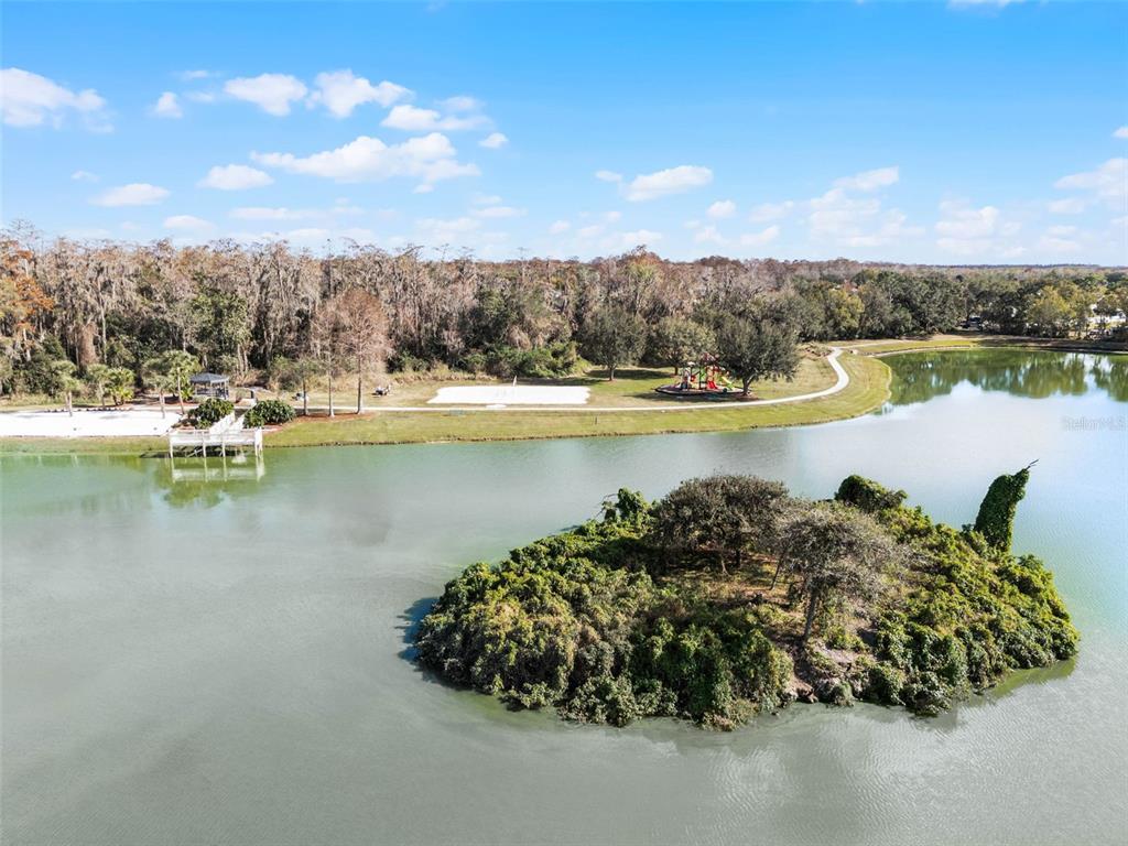 1086 Park Ridge Circle Kissimmee, FL 34746 - Photo 54 of 57 a view of a lake with houses in back