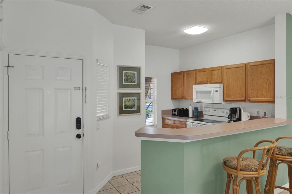 1086 Park Ridge Circle Kissimmee, FL 34746 - Photo 6 of 57 a kitchen with a sink cabinets and a window